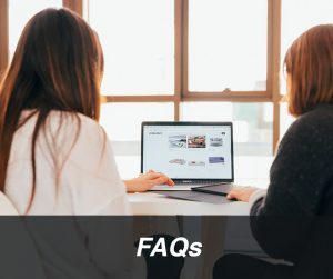 FAQs - Two women looking at website